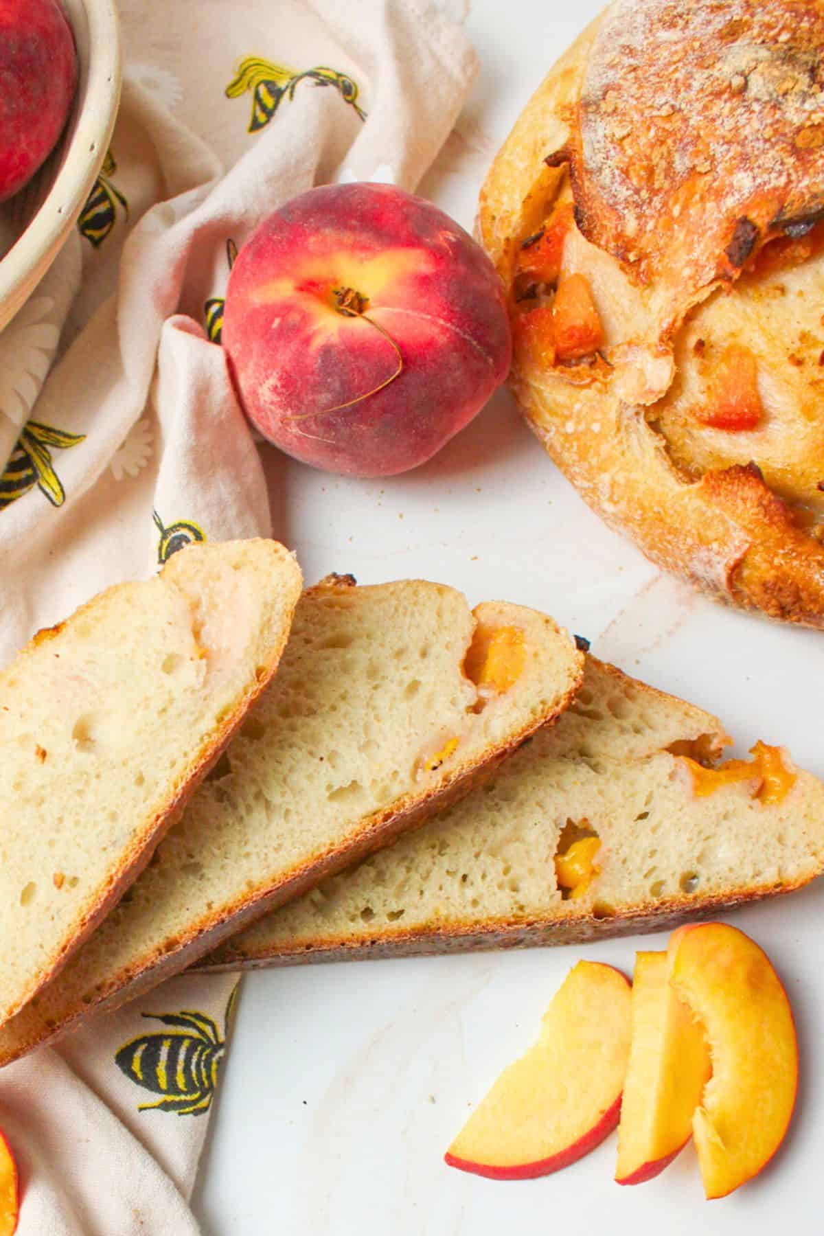 sliced peach sourdough bread with sliced fresh peaches.