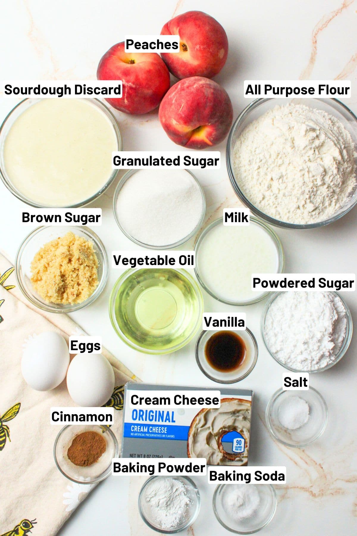 labeled ingredients needed to make sourdough peaches and cream muffins.