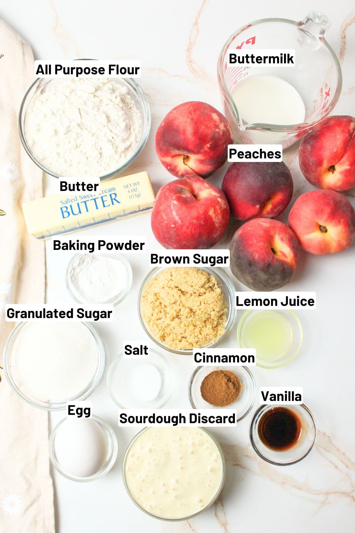 labeled ingredients needed to make sourdough peach cobbler.