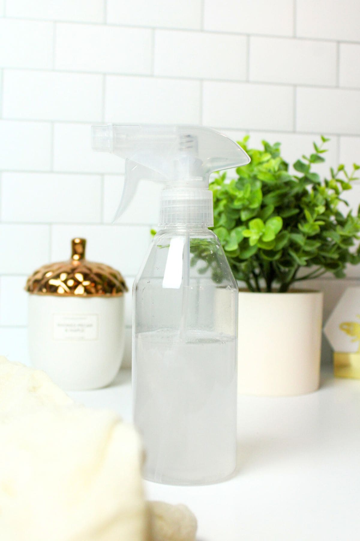 dryer sheet spray in a clear bottle.