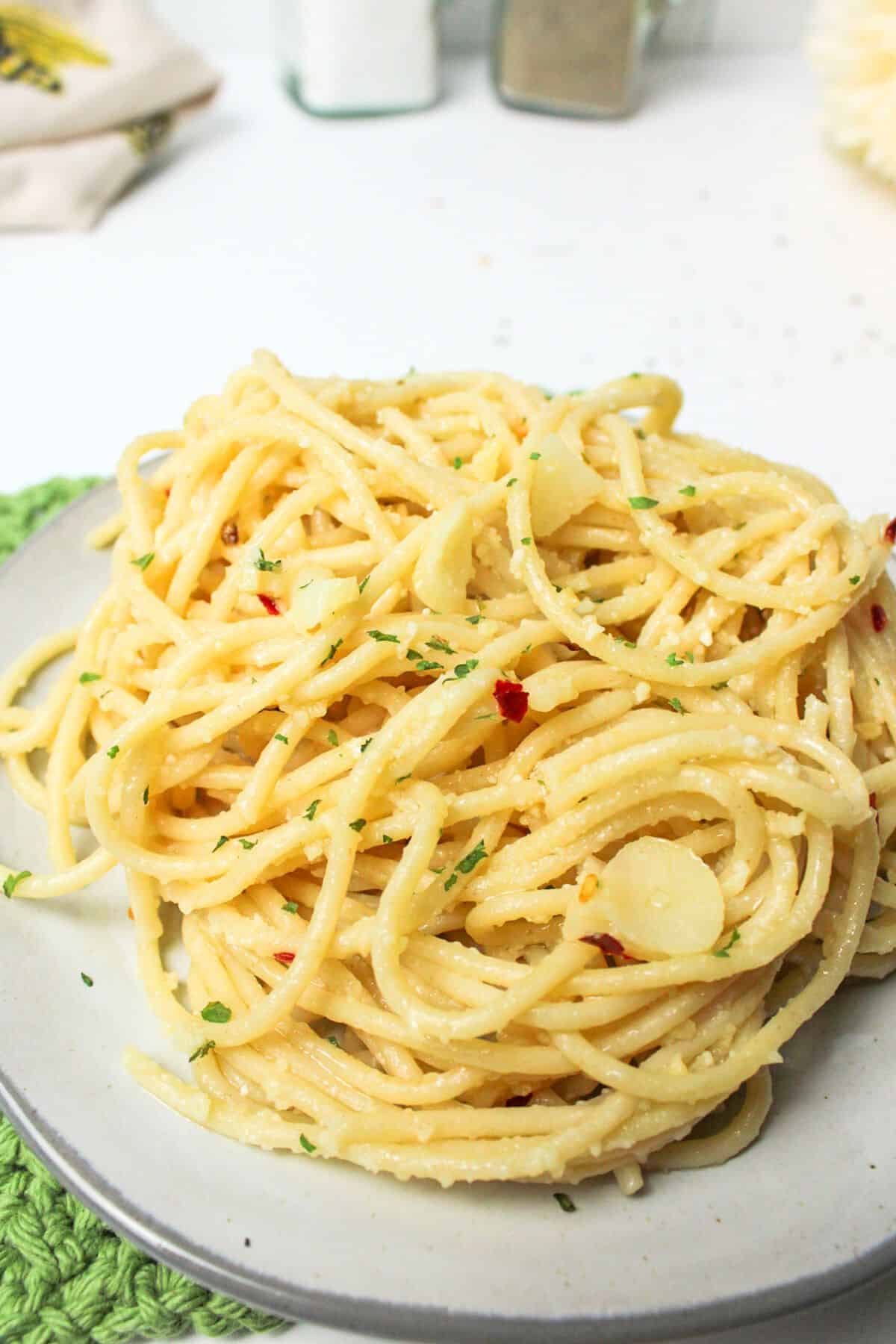 a plate full of garlic and oil spaghetti.