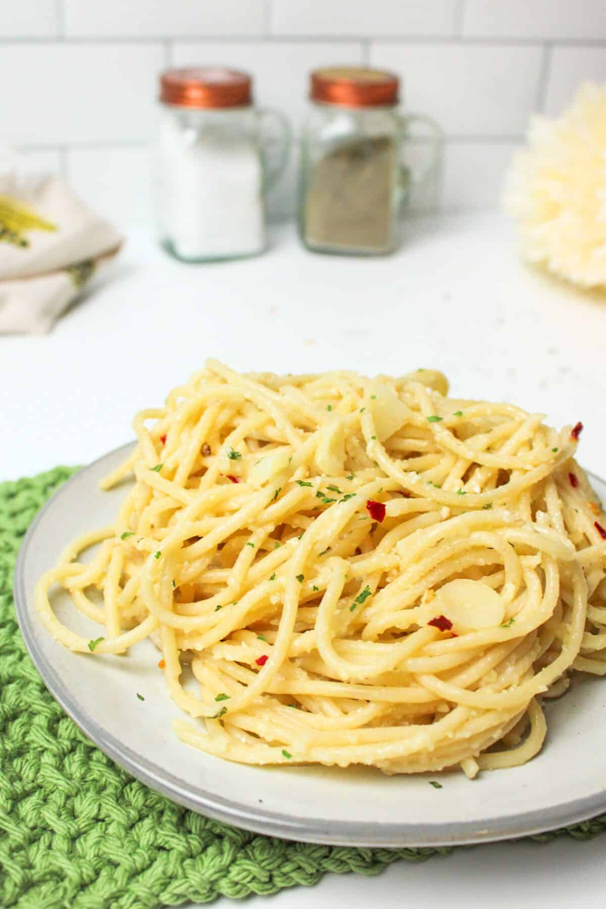garlic and oil spaghetti on a plate.