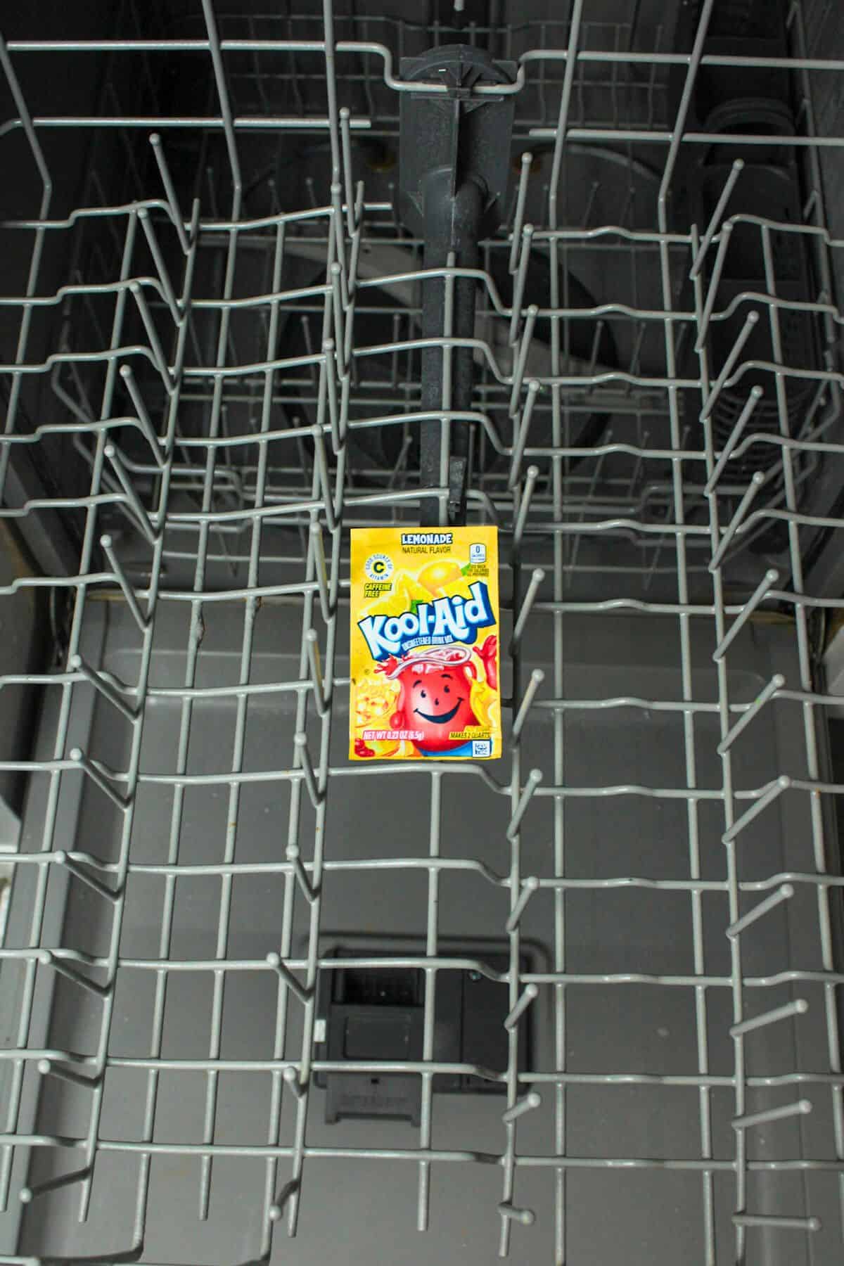 a packet of lemonade kool aid on top rack in dishwasher.