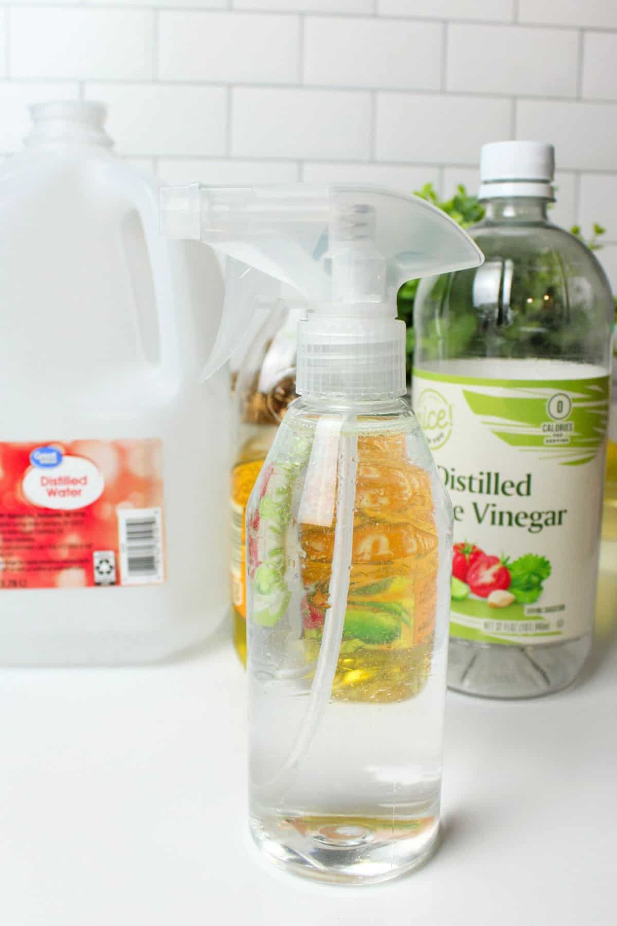 stainless steel cleaner and polish in a bottle in front of ingredients.