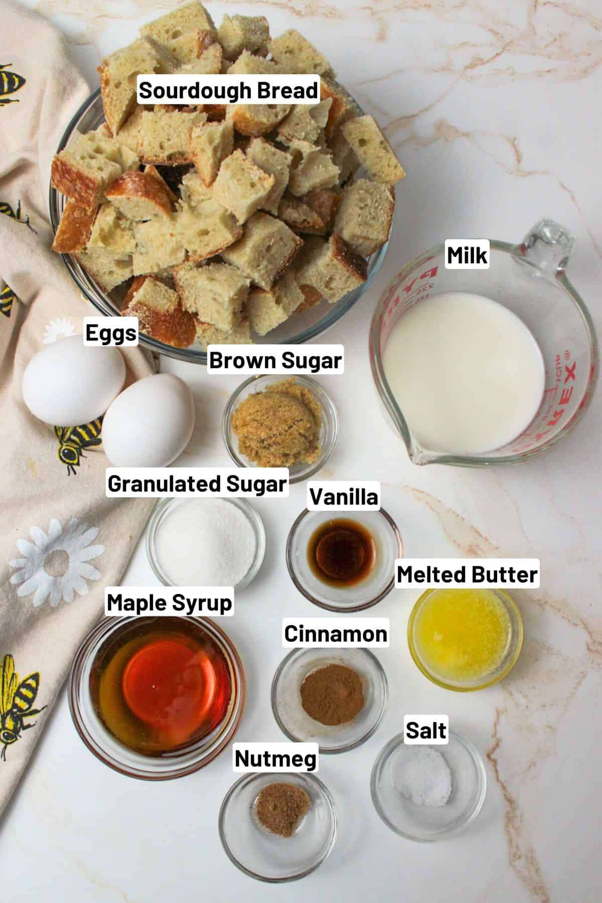 labeled ingredients needed to make sourdough french toast bake.