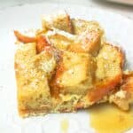 sourdough french toast bake topped with maple syrup.
