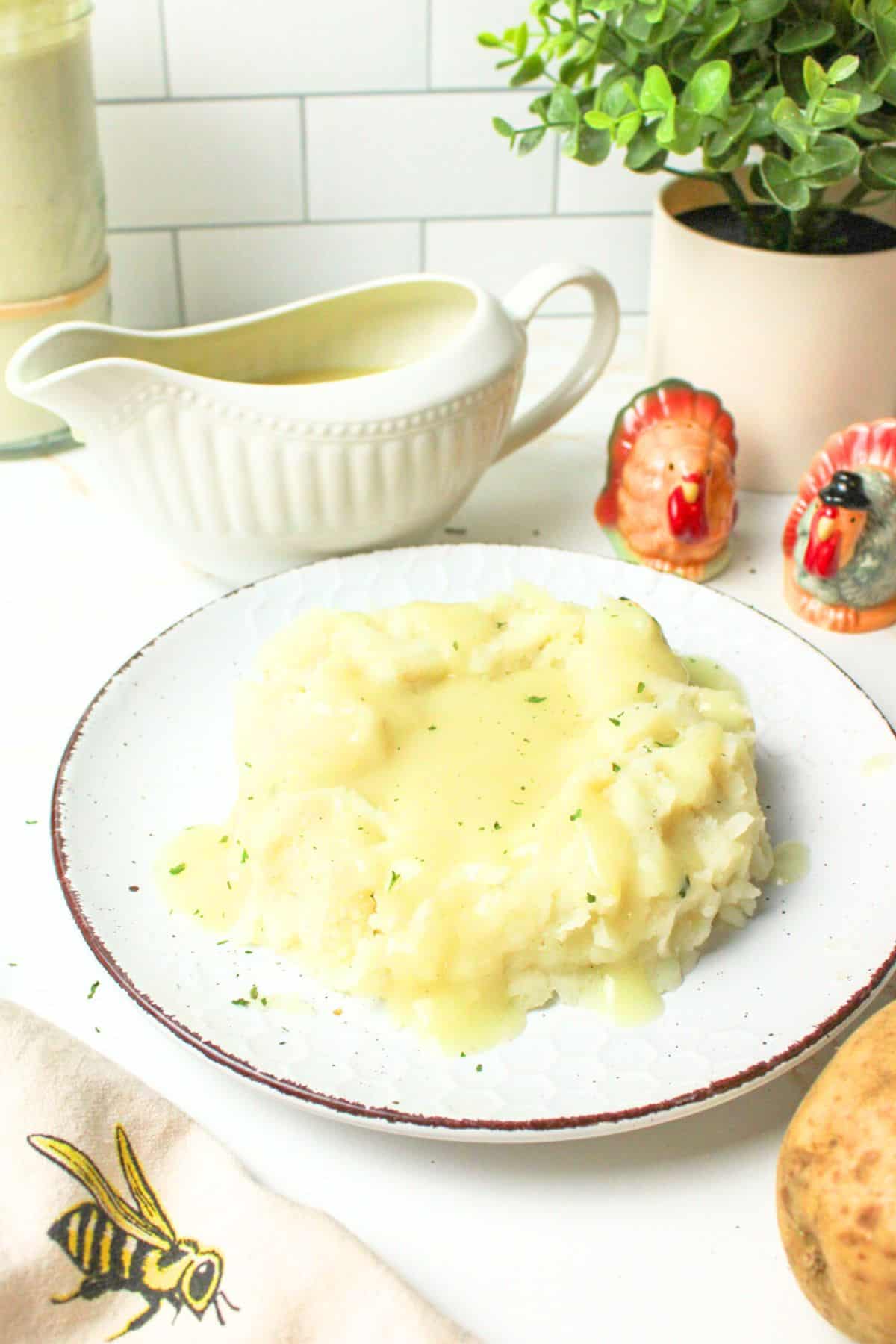 sourdough gravy on a plate of mashed potatoes.