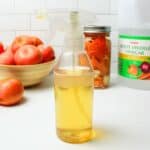 clear spray bottle full of citrus cleaner.