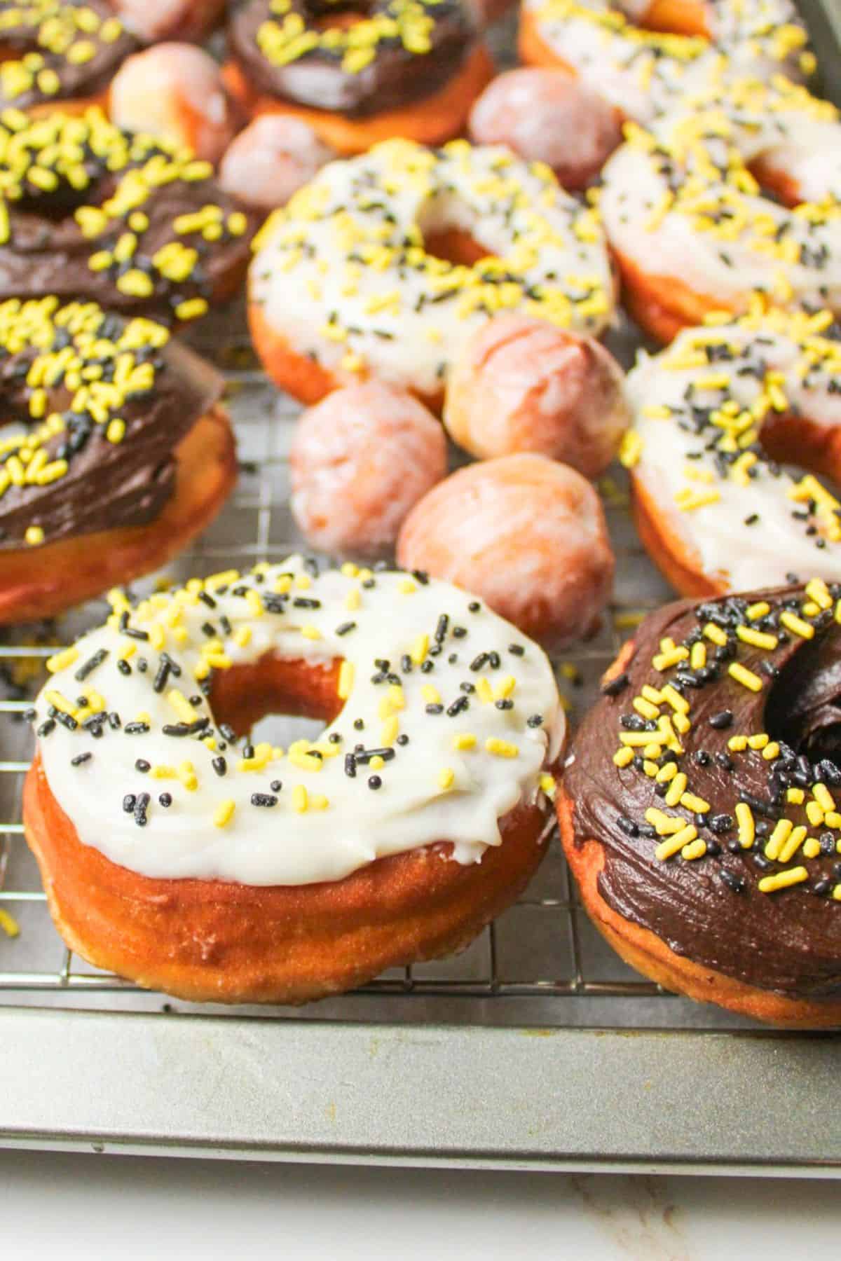 glazed donuts on a baking sheet.