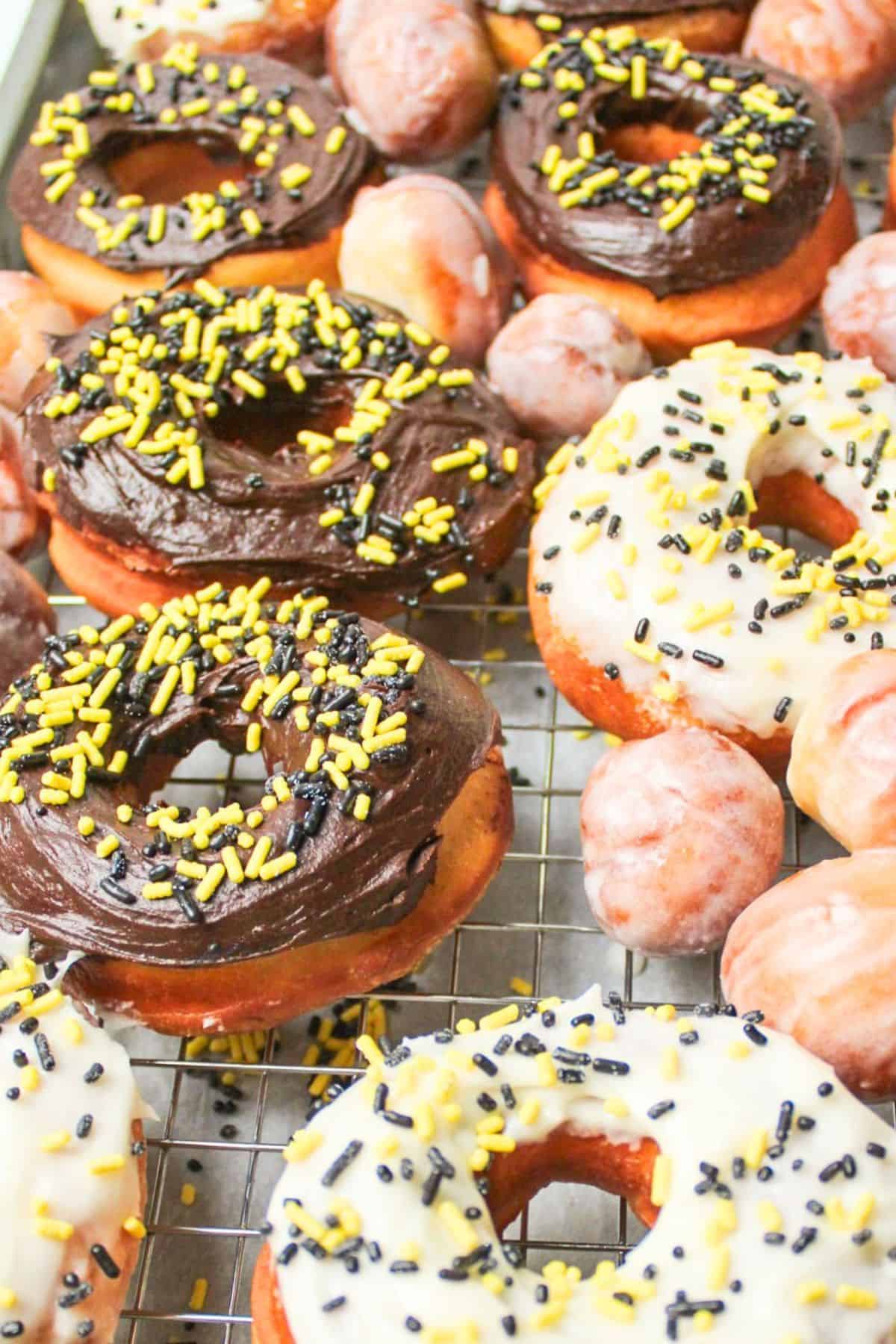 glazed dairy free donuts on a baking sheet.