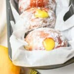 powdered sugar covered lemon curd donuts.