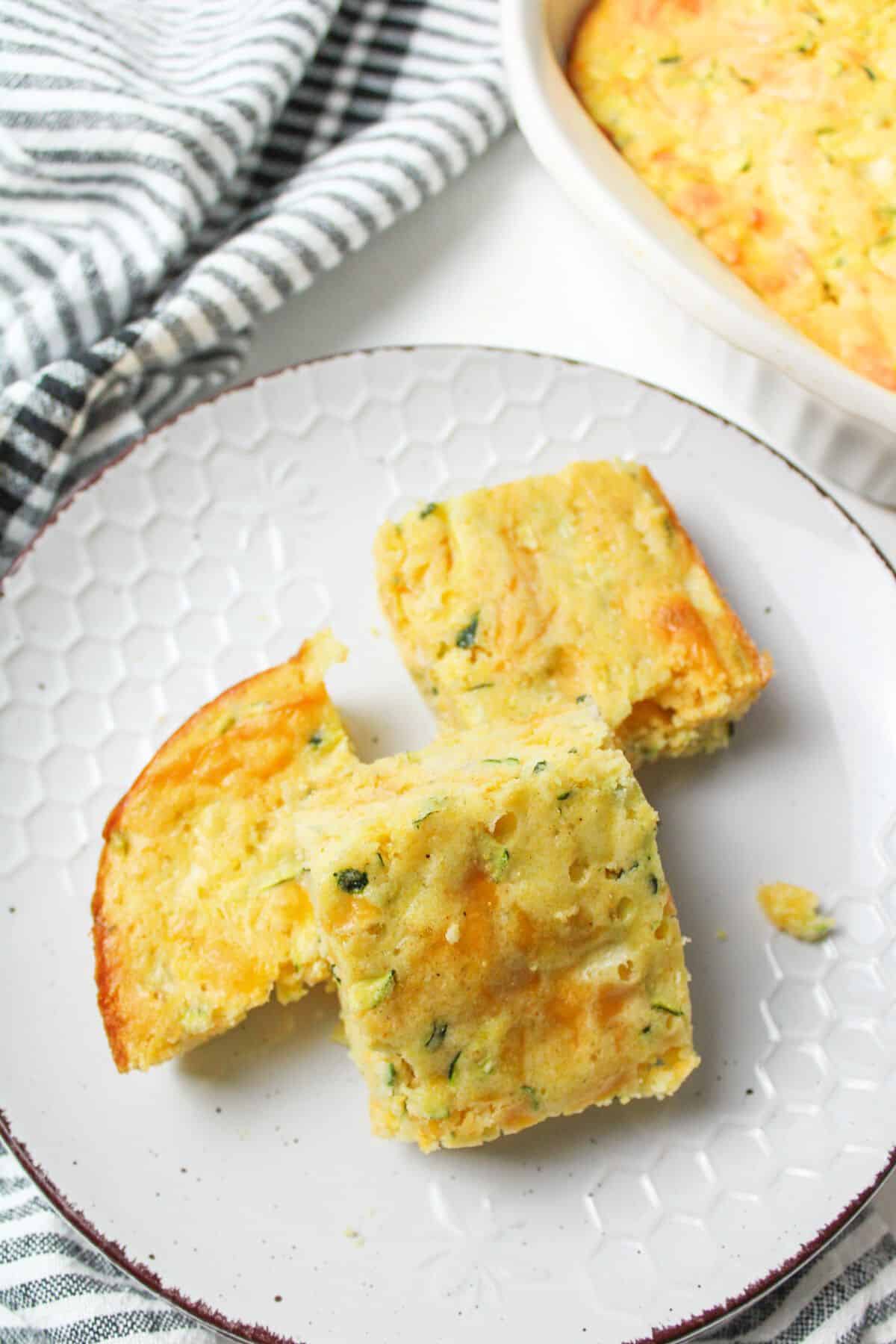 sliced zucchini cornbread on plate.