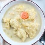 creamy turkey dumpling soup in a bowl.