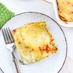 sliced turkey lasagna on a plate with a fork.