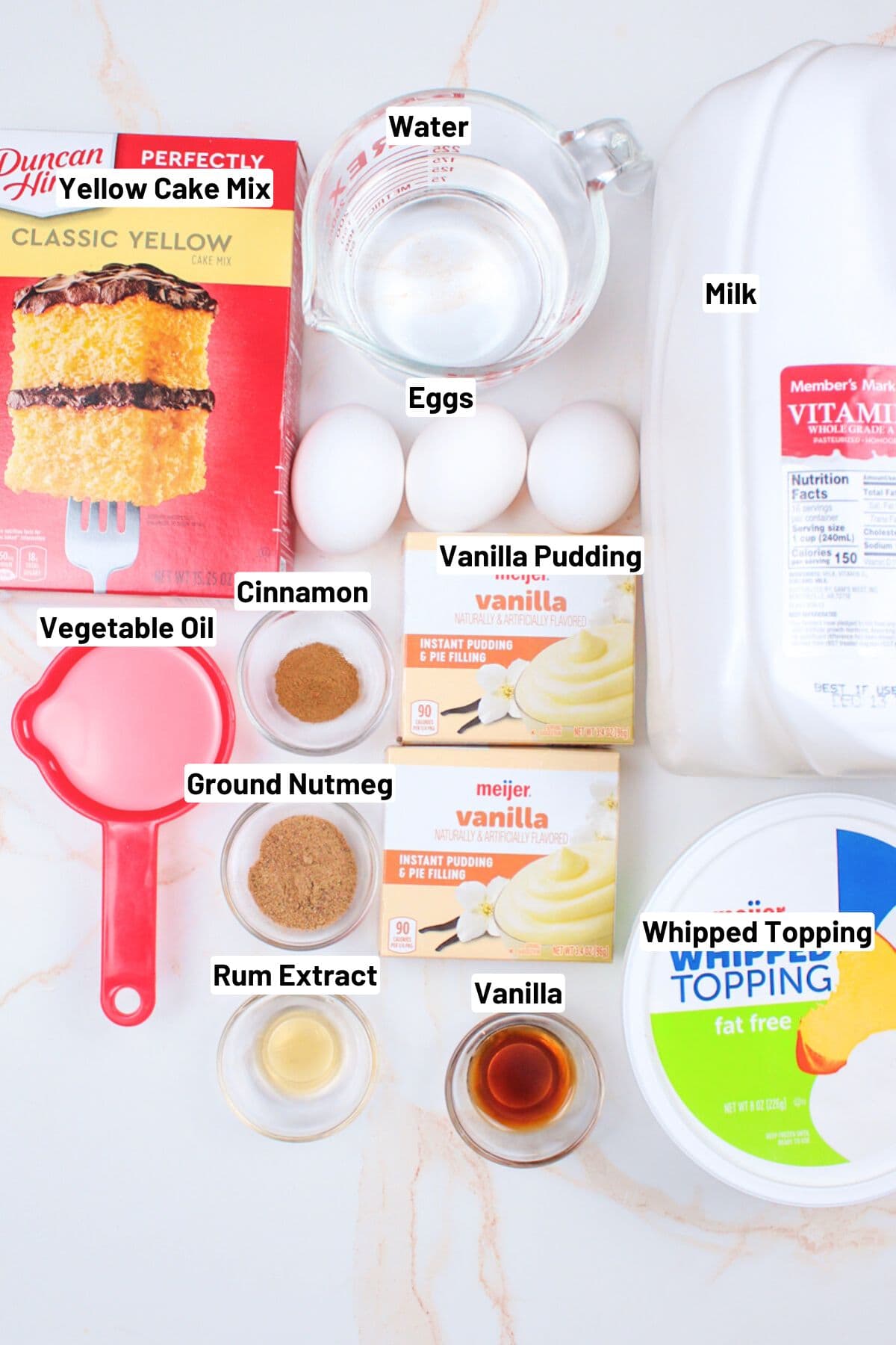 labeled ingredients needed to make eggnog poke cake.