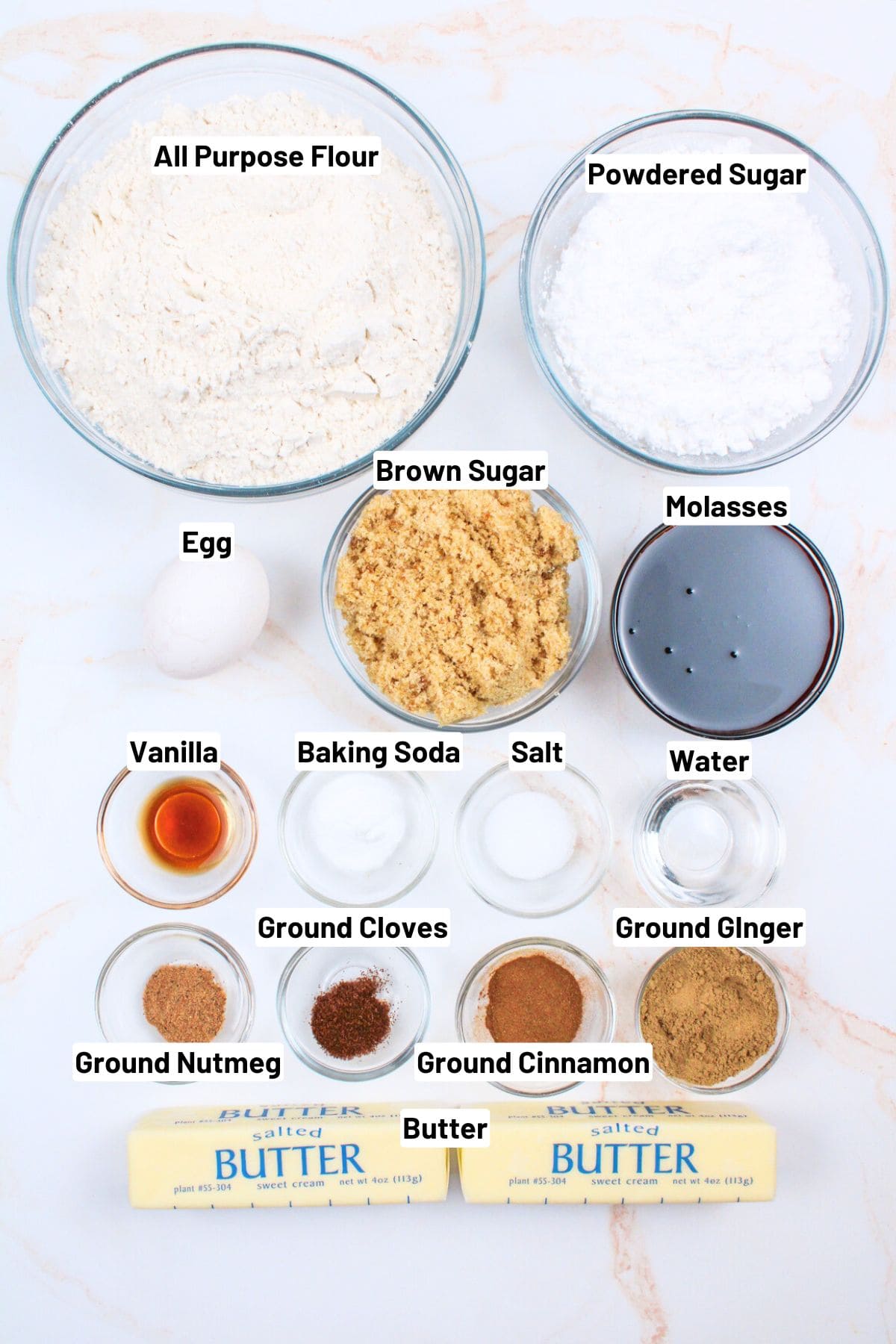 labeled ingredients needed to make iced gingerbread cookies.