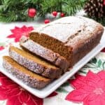 sliced gingerbread loaf on a plate.
