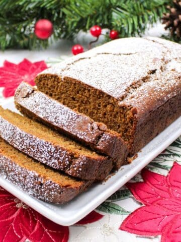sliced gingerbread loaf on a plate.