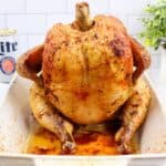 beer can chicken in a baking dish.