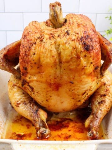 beer can chicken in a baking dish.