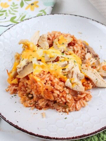 cheesy salsa chicken and rice on a serving plate.