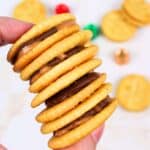hand holding a stack of rolo stuffed ritz crackers.