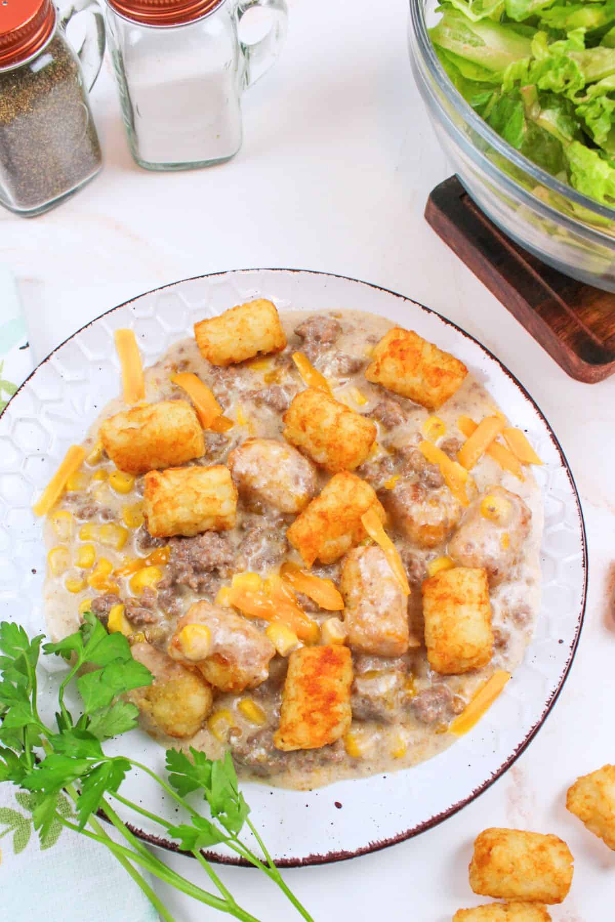 tater tot casserole served on a white plate.